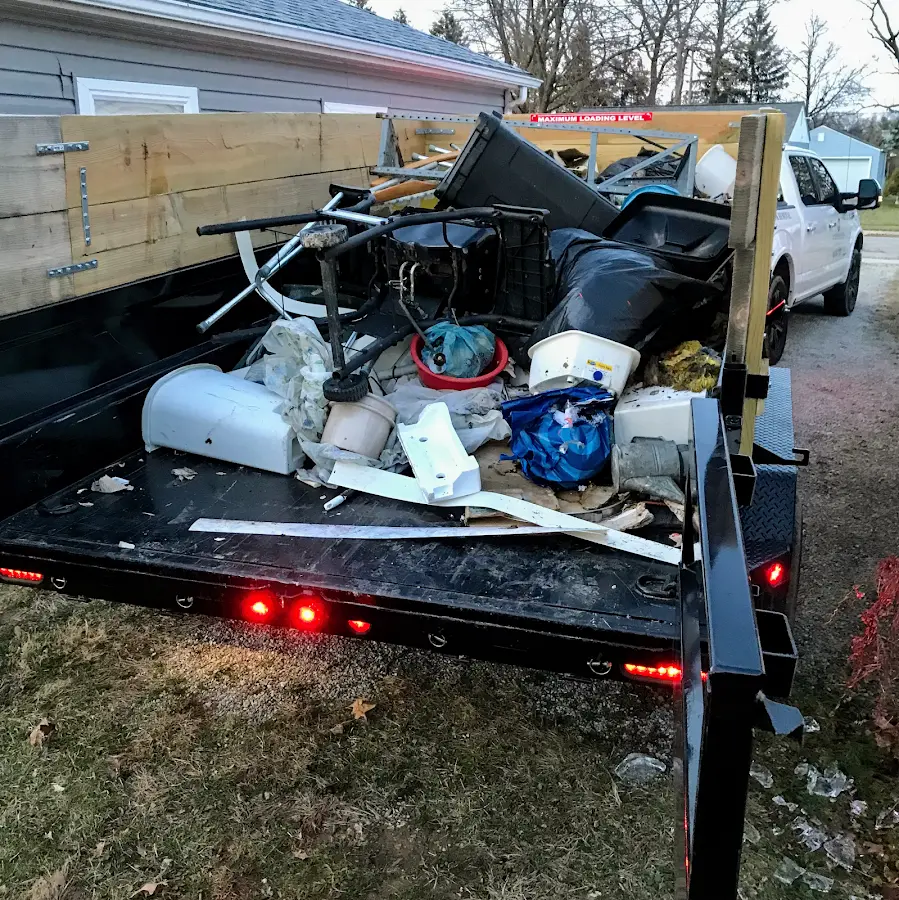 Roll-off dumpster delivered to a residential driveway in Hypoluxo